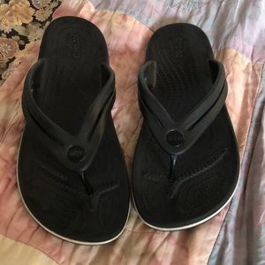 Crocs black flip flops in size 8